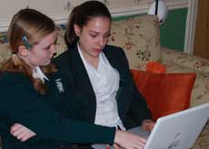 Two children using a laptop computer