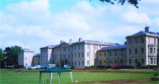 Photograph of Northampton General Lunatic Asylum, showing the croquet lawn in the foreground.